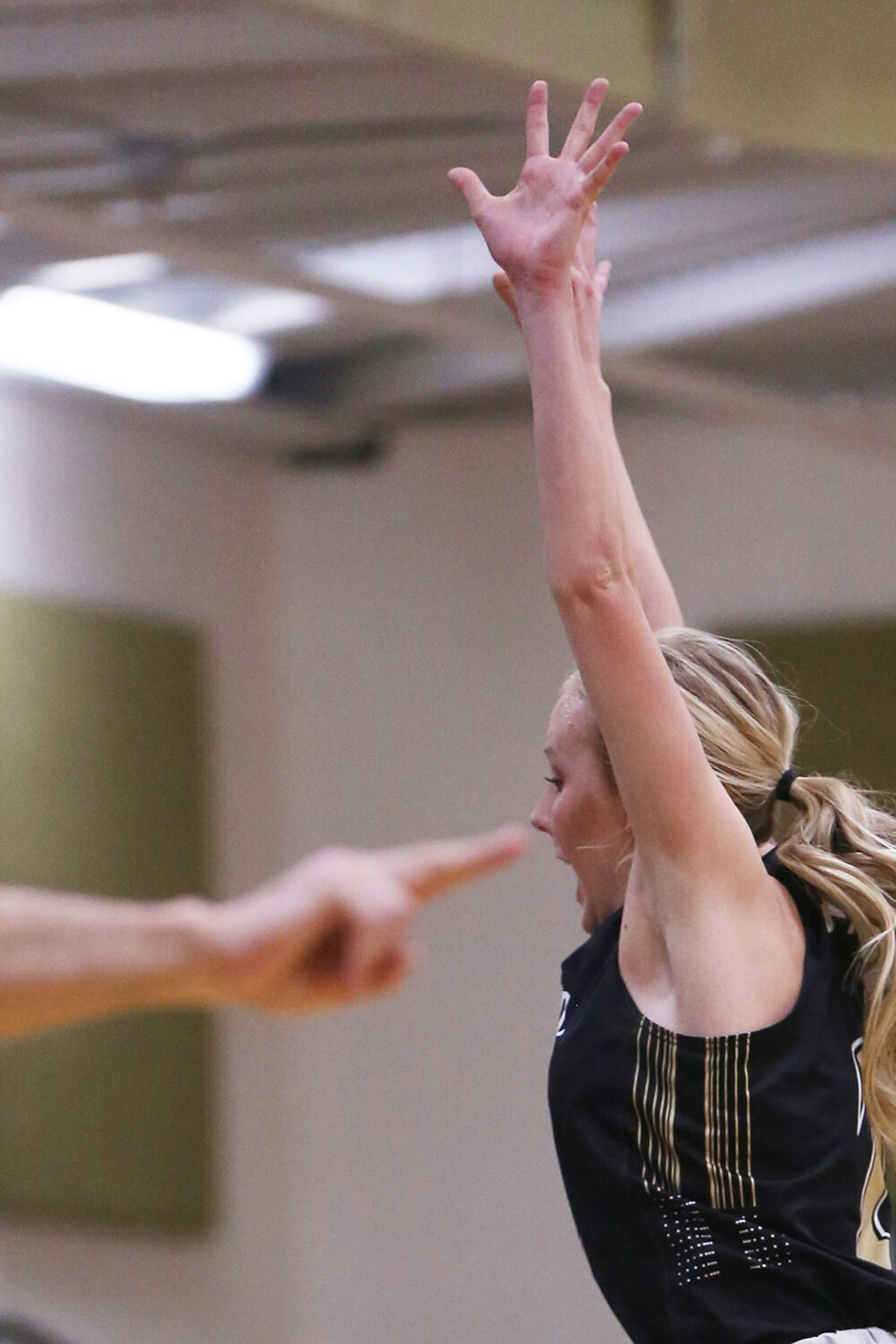 Kendall Tietjen jumps and waves her arms